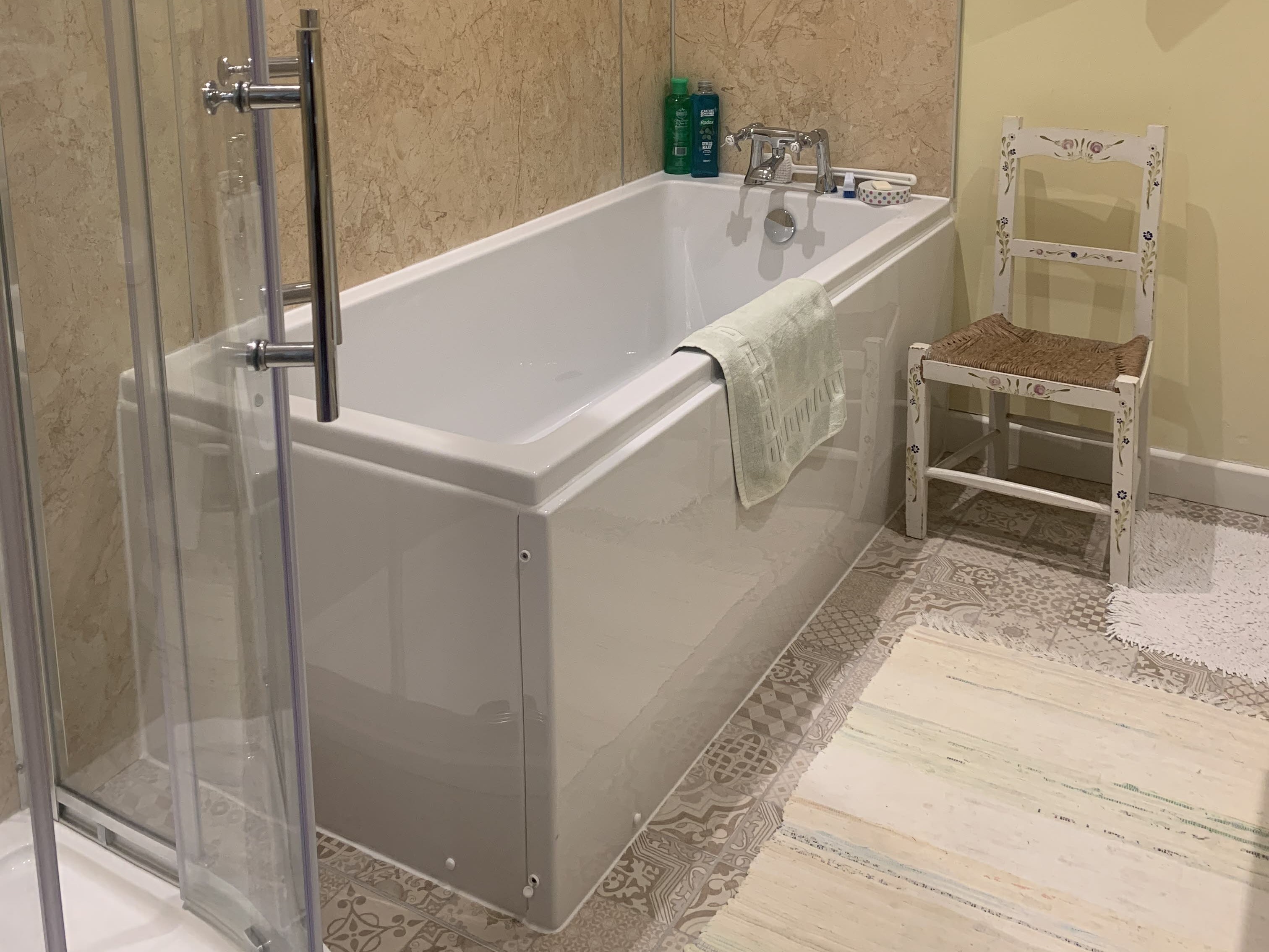 White bath tub, in a bathroom